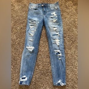 American Eagle distressed blue jeans with some patching. Size 6 short.